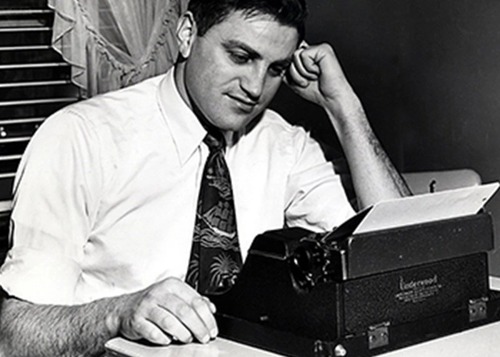 Ed Guthman at his typewriter.