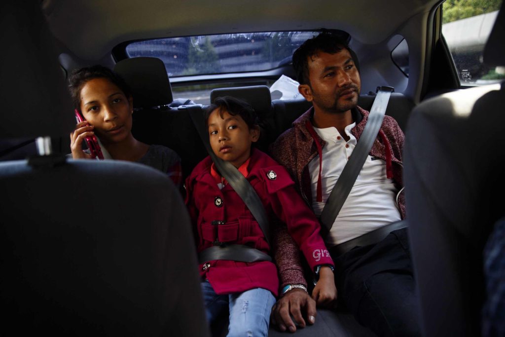 Bhagi Biswa, left, rides with her relatives Pranshu and Birkha Biswa from Sea-Tac Airport. Birkha said he was amazed by the number of planes at the airport, as well of the quality of houses and roads in the United States. Bhagi graduated from Foster High School, and is now is pursing her dream to be a doctor at Washington State University.